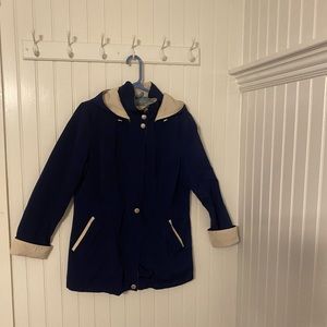 COPY - price drop: This jacket is navy blue with cream cuffs and lining.